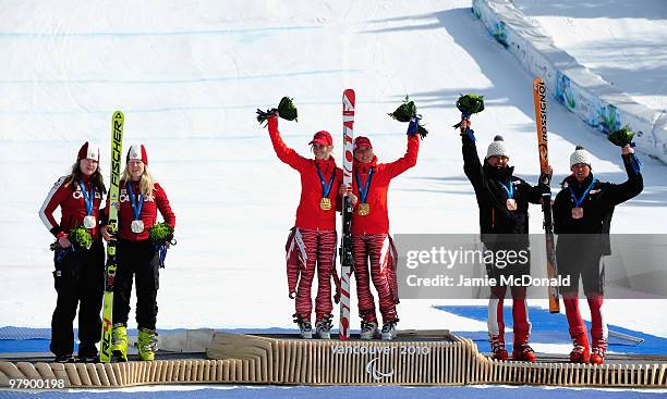 Gold medalists Henrieta Farkasova of Slovakia and guide Natalia Subrtova, silver medalists Viviane Forest of Canada and guide Lindsay Debou and...