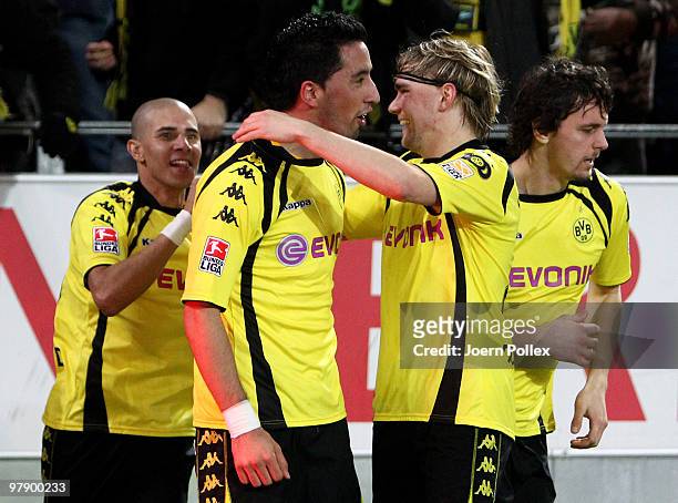 Lucas Barrios of Dortmund celebrates with his team mates after scoring his team's first goal during the Bundesliga match between Borussia Dortmund...