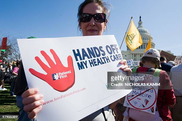 Supporters of the Tea Party movement demonstrate outside the US Capitol in Washington, DC, on March 20, 2010 against the healthcare bill which is...