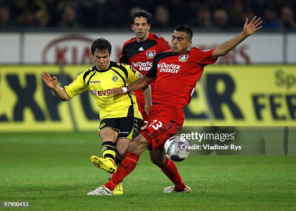 Tamas Hajnal of Dortmund and Arturo Vidal of Leverkusen in action during the Bundesliga match between Borussia Dortmund and Bayer Leverkusen at...