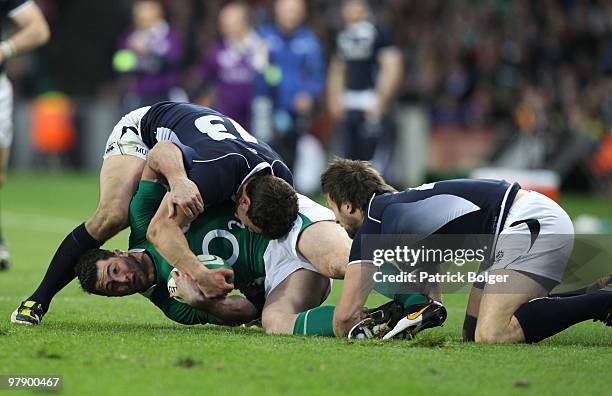 Rob Kearney of Ireland concedes the last minute penalty under pressure from Nick De Luca and Simon Danielli of Scotland during the RBS Six Nations...
