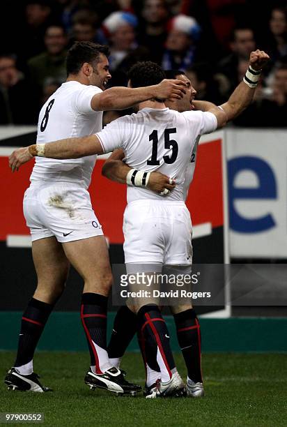 Ben Foden of England is congratulated by teammates Nick Easter and Riki Flutey after scoring the opening try during the RBS Six Nations Championship...