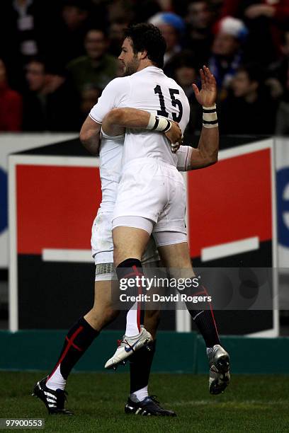 Ben Foden of England is congratulated by teammate Riki Flutey after scoring the opening try during the RBS Six Nations Championship match between...