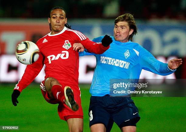 Peter Odemwingie of FC Lokomotiv Moscow battles for the ball with Aleksandr Belozyorov of FC Krylia Sovetov Samara during the Russian Football League...