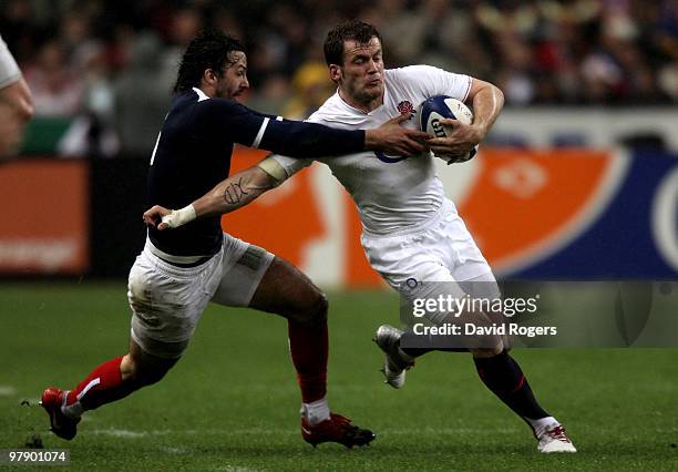 Mark Cueto of England is tackled by Clement Poitrenaud of France during the RBS Six Nations Championship match between France and England at the...