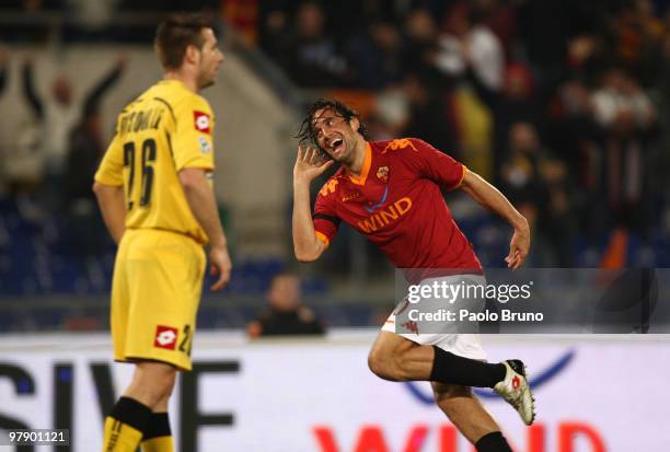 Luca Toni of AS Roma celebrates after scoring the opening goal of the Serie A match between AS Roma and Udinese Calcio at Stadio Olimpico on March...