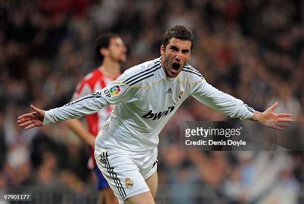 Gonzalo Higuain of Real Madrid celebrates after scoring Real's third goal during the La Liga match between Real Madrid and Sporting Gijon at Estadio...