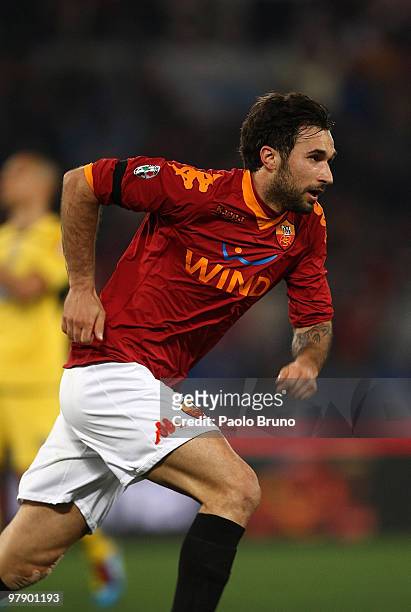 Mirko Vucinic of AS Roma celebrates after scoring the 2:0 goal during the Serie A match between AS Roma and Udinese Calcio at Stadio Olimpico on...