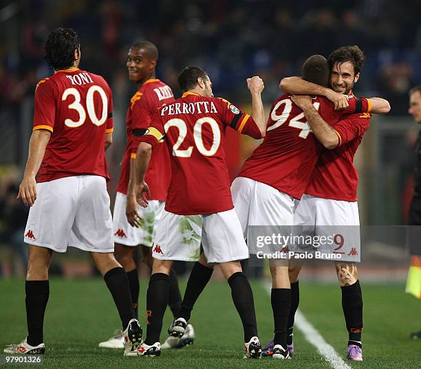 Mirko Vucinic of AS Roma celebrates his 2:0 goal with teammates Jeremy Menez , Simone Perrotta and Luca Toni during the Serie A match between AS Roma...