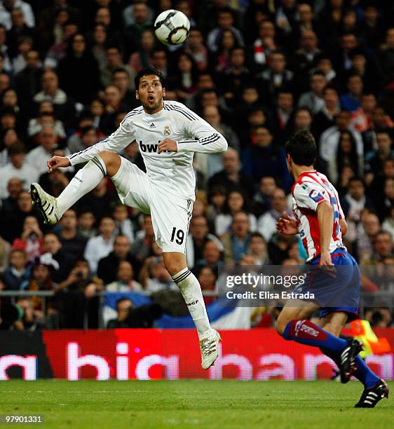 Ezequiel Garay of Real Madrid controls the ball during the La Liga match between Real Madrid and Sporting Gijon at Estadio Santiago Bernabeu on March...