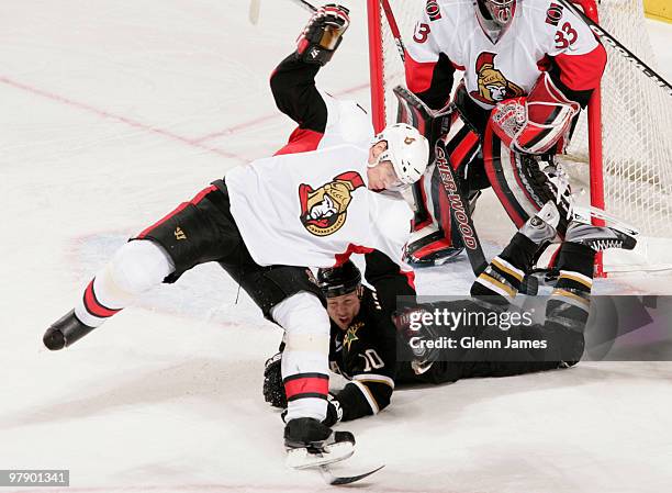 Anton Volchenkov of the Ottawa Senators is taken off his skates by Brenden Morrow of the Dallas Stars on March 20, 2010 at the American Airlines...