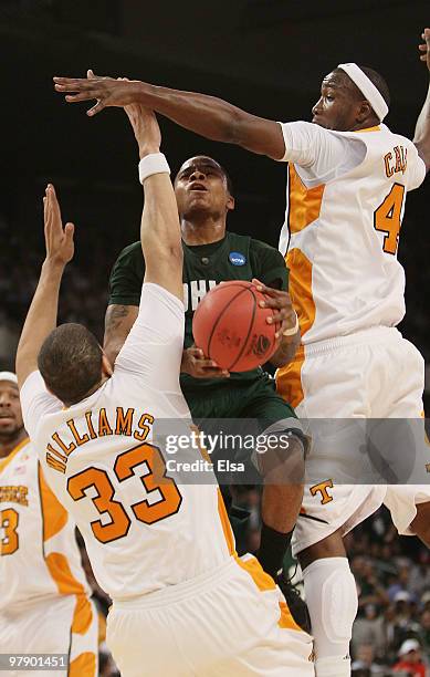 Cooper of the Ohio Bobcats heads for the net as Brian Williams and Wayne Chism of the Tennessee Volunteers defend during the second round of the 2010...