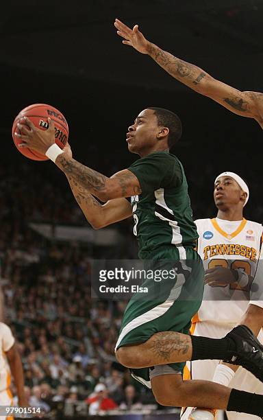 Cooper of the Ohio Bobcats heads for the net as Scotty Hopson of the Tennessee Volunteers defends during the second round of the 2010 NCAA men's...