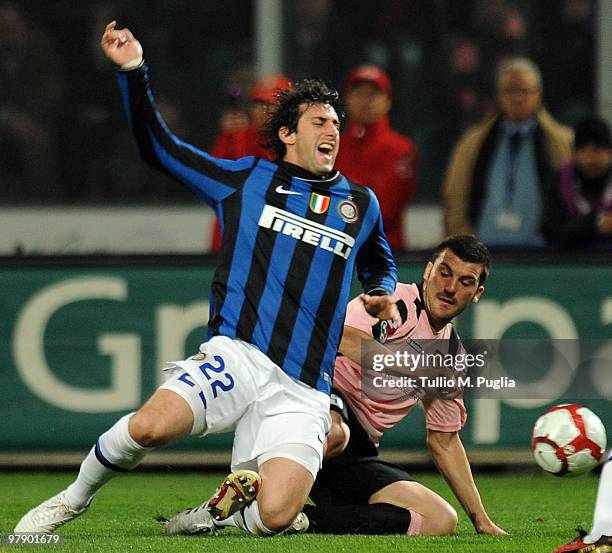 Cesare Bovo of Palermo tangles with Diego Milito of Internazionale Milano during the Serie A match between US Citta di Palermo and FC Internazionale...