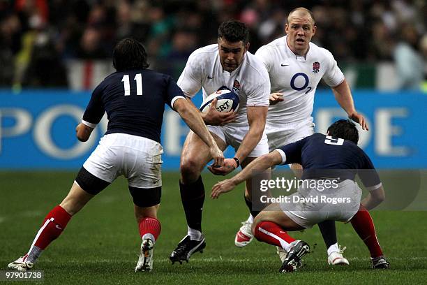 Nick Easter of England is tackled by Alexis Palisson and Morgan Parra of France during the RBS Six Nations Championship match between France and...