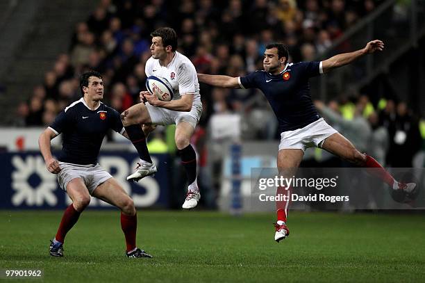 Mark Cueto of England claims the high ball ubder pressure from Francois Trinh-Duc and David Marty of France during the RBS Six Nations Championship...