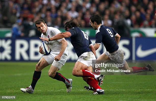 Mark Cueto of England takes on Dimitri Szarzewski and Morgan Parra of France during the RBS Six Nations Championship match between France and England...