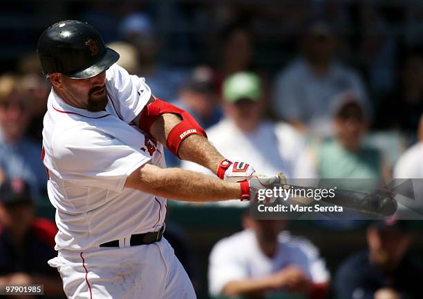 Kevin Youkilis of the Boston Red Sox hits a two run home run against the Baltimore Orioles on March 20, 2010 at City of Palms Park in Fort Myers,...