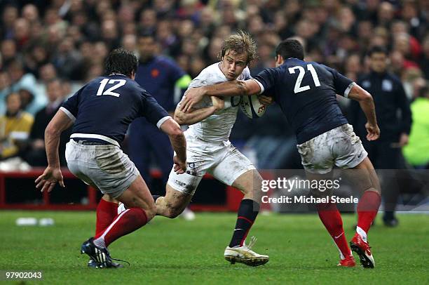 Mathew Tait of England is tackled by David Marty of France during the RBS Six Nations Championship match between France and England at the Stade de...