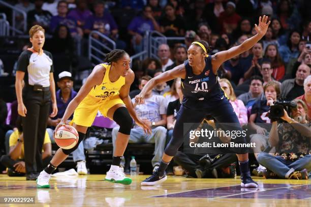 Nneka Ogwumike of the Los Angeles Sparks handles the ball against Kayla Alexander of the Indiana Fever during a WNBA basketball game at Staples...