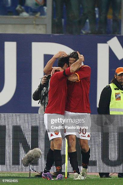 Mirko Vucinic with his teammate Luca Toni of AS Roma celebrates the third goal during the Serie A match between AS Roma and Udinese Calcio at Stadio...