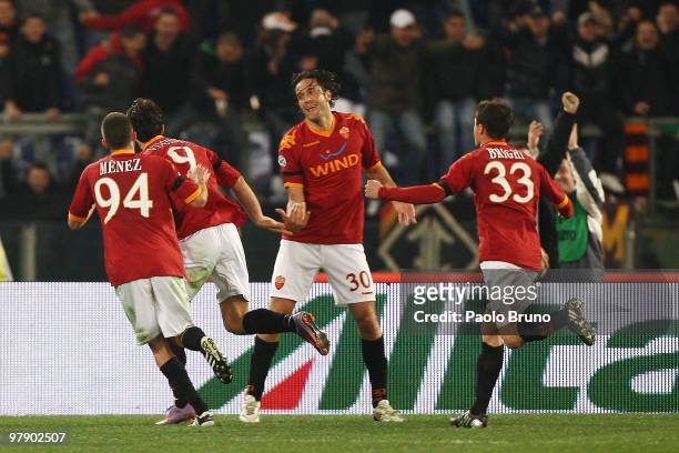 Mirko Vucinic with his tammates of AS Roma celebrates the third goal during the Serie A match between AS Roma and Udinese Calcio at Stadio Olimpico...
