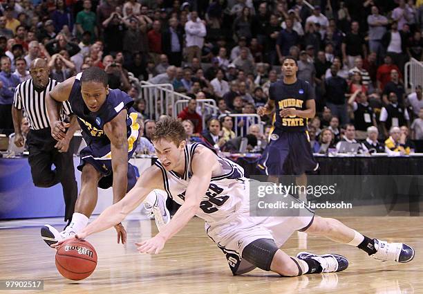 Guard Gordon Hayward of the Butler Bulldogs dives after the ball with guard Isaiah Canaan of the Murray State Racers as time expires in the second...