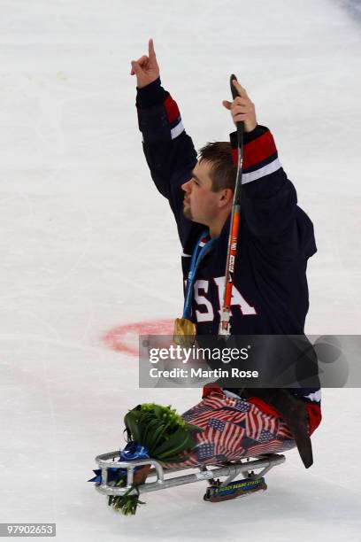 Alexi Salamone of the United States celebrates defeating Japan 2-0 during the Ice Sledge Hockey Gold Medal Game between the United States and Japan...