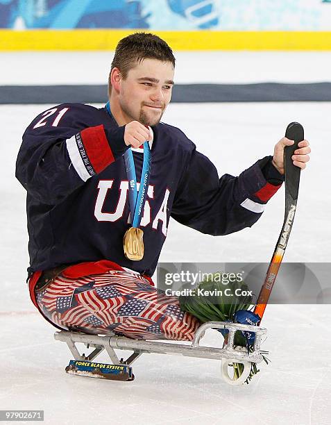 Alexi Salamone of the United States celebrates defeating Japan 2-0 during the Ice Sledge Hockey Gold Medal Game between the United States and Japan...