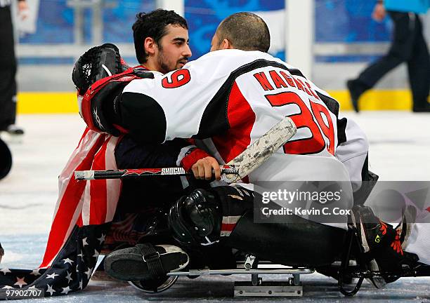 Goalkeeper Steve Cash of the United States is congratulated by goalkeeper Mitsuru Nagase of Japan after the United States 2-0 win over Japan during...