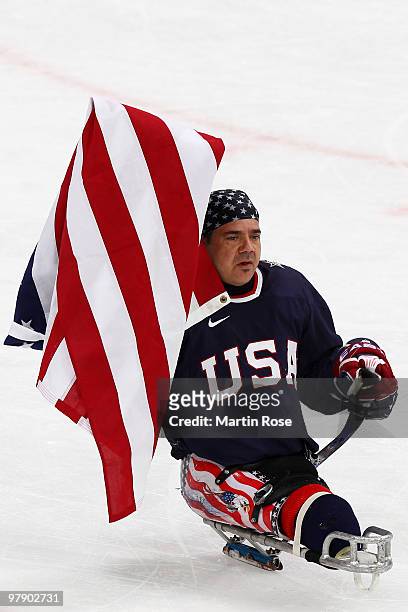 Joe Howard of the United States celebrates their 2-0 victory over Japan during the Ice Sledge Hockey Gold Medal Game on day nine of the 2010...