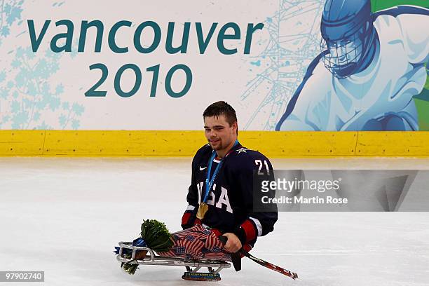 Alexi Salamone of the United States celebrates defeating Japan 2-0 during the Ice Sledge Hockey Gold Medal Game between the United States and Japan...