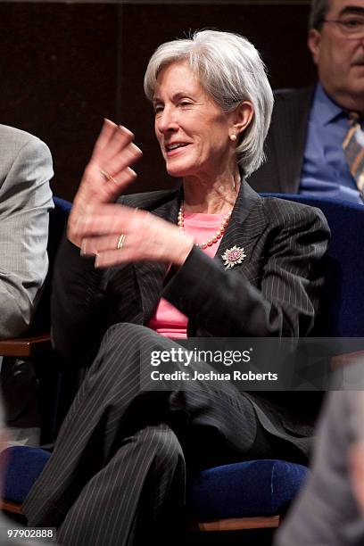 Kathleen Sebelius, Secretary of Health and Human Services speaks with a member of Congress before U.S. President Barack Obama spoke to the Democratic...