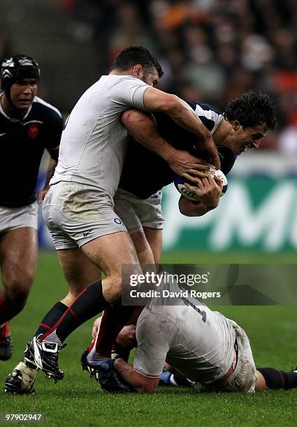 Yannick Jauzion of France is tackled by Nick Easter of England during the RBS Six Nations Championship match between France and England at the Stade...