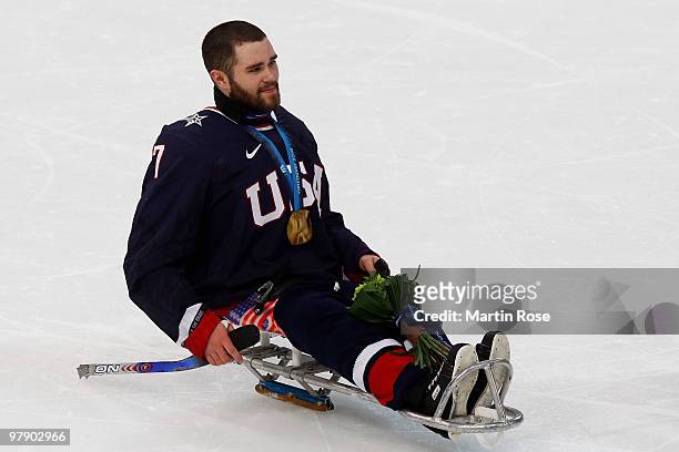 Taylor Lipsett of the United States celebrates defeating Japan 2-0 during the Ice Sledge Hockey Gold Medal Game between the United States and Japan...