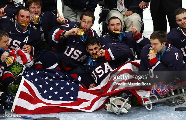 Team USA celebrates their 2-0 win over Japan during the Ice Sledge Hockey Gold Medal Game between the United States and Japan on day nine of the 2010...