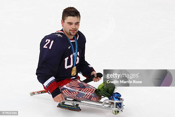 Alexi Salamone of the United States celebrates defeating Japan 2-0 during the Ice Sledge Hockey Gold Medal Game between the United States and Japan...