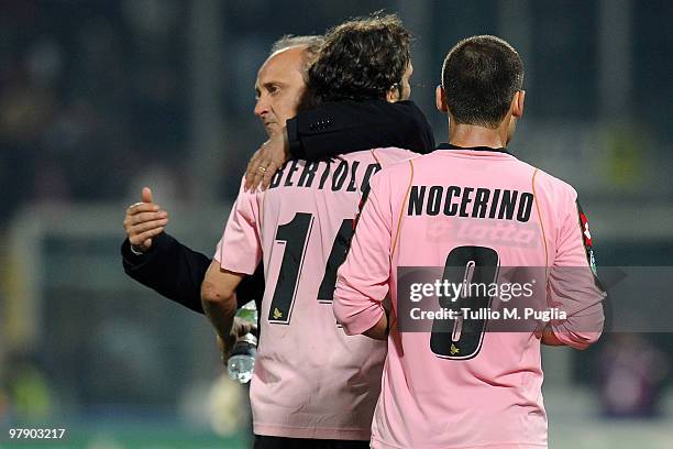 Coach Delio Rossi embraces Nicolas Bertolo beside Antonio Nocerino during the Serie A match between US Citta di Palermo and FC Internazionale Milano...