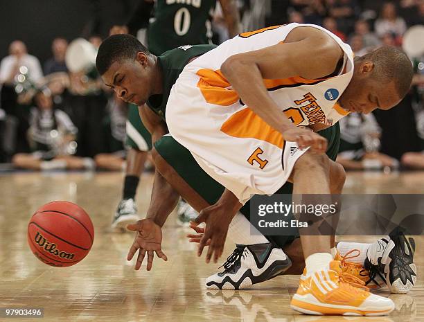 DeVaughn Washington f the Ohio Bobcats and J.P. Prince of the Tennessee Volunteers fight for the loose ball during the second round of the 2010 NCAA...