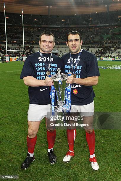 Nicolas Mas and David Marty of France hold the trophy after France completed the Grand Slam during the RBS Six Nations Championship match between...