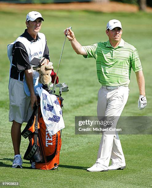 Justin Leonard pulls a golf club from his bag on the 15th fairway during the third round of the Transitions Championship at the Innisbrook Resort and...