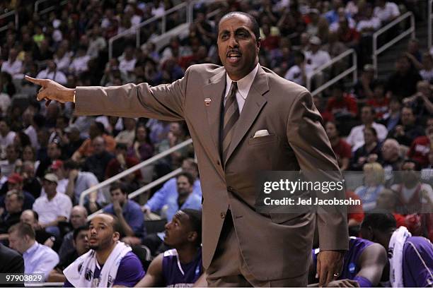 Head coach Lorenzo Romar of the Washington Huskies watches game action against the New Mexico Lobos during the second round of the 2010 NCAA men's...