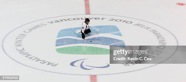 Takayuki Endo of Japan starts at center ice to shoot a pentalty shot against the United States during the second period of the Ice Sledge Hockey Gold...