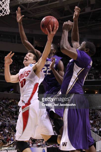 Forward Roman Martinez of the New Mexico Lobos goes up for a shot against the Washington Huskies in the second round of the 2010 NCAA men's...
