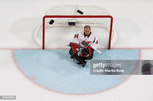 Goalkeeper Mitsuru Nagase of Japan looks on from the net during the Ice Sledge Hockey Gold Medal Game between the United States and Japan on day nine...