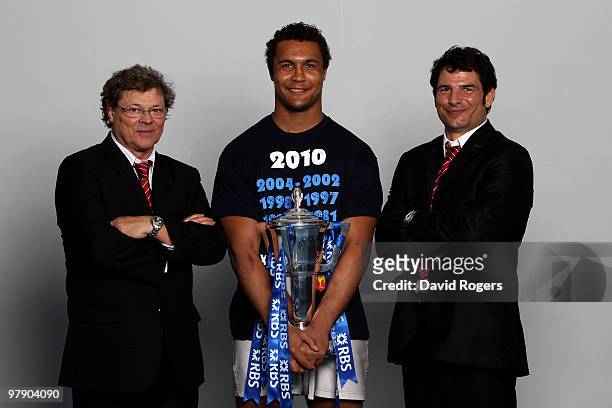 Jo Maso the manager of France, Thierry Dusautoir the captain of France and Marc Lievremont the head coach of France celebrate with the trophy after...