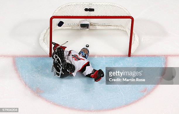 Goalkeeper Mitsuru Nagase of Japan lays on his back after allowing a goal by Taylor Lipsett of the United States during the Ice Sledge Hockey Gold...