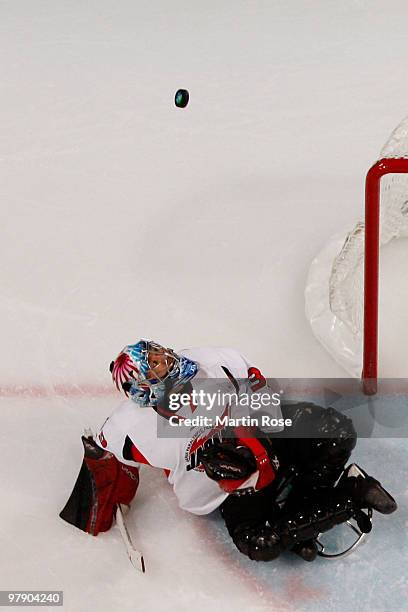 Goalkeeper Mitsuru Nagase of Japan looks at the puck as it flies over the net during the Ice Sledge Hockey Gold Medal Game between the United States...