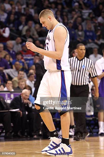 Cole Aldrich of the Kansas Jayhawks appears to be in pain as he walks towards the bench against the Northern Iowa Panthers during the second round of...