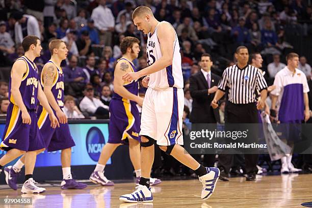 Cole Aldrich of the Kansas Jayhawks appears to be in pain as he walks towards the bench against the Northern Iowa Panthers during the second round of...